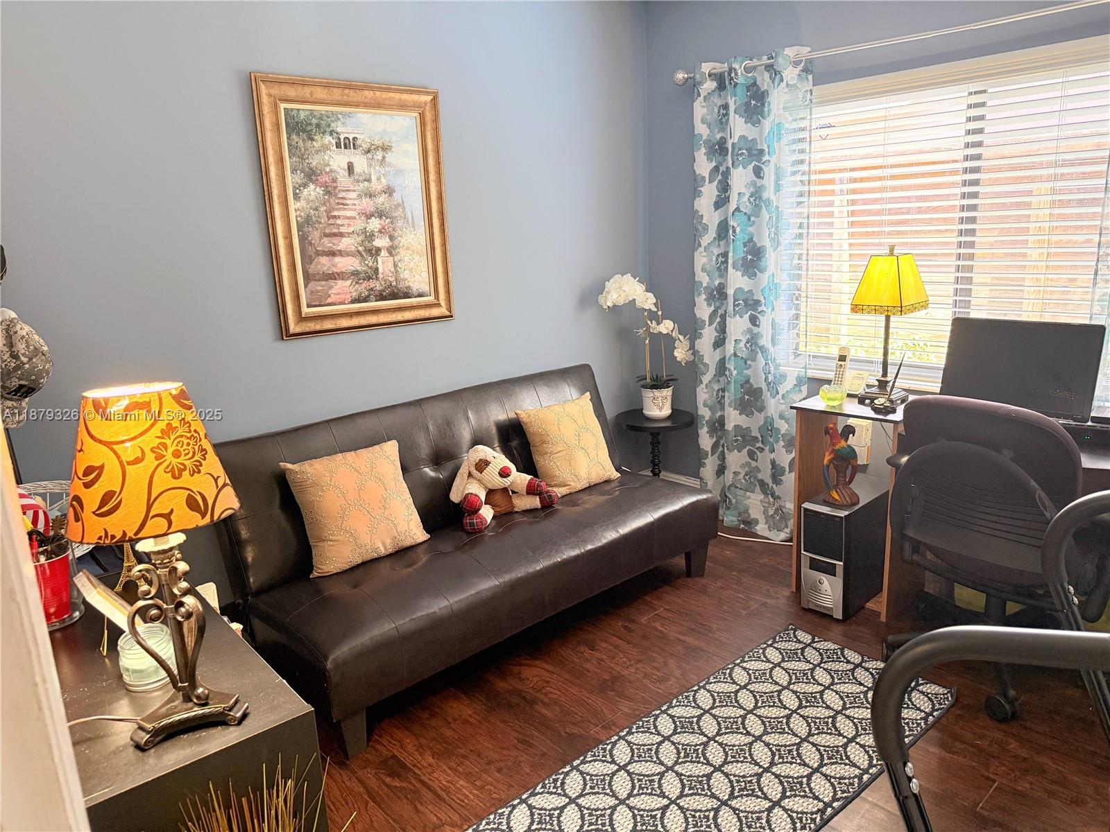 14856 Southwest 174th Street Miami, FL 33187 - Photo 23 of 31 a living room with furniture and a window
