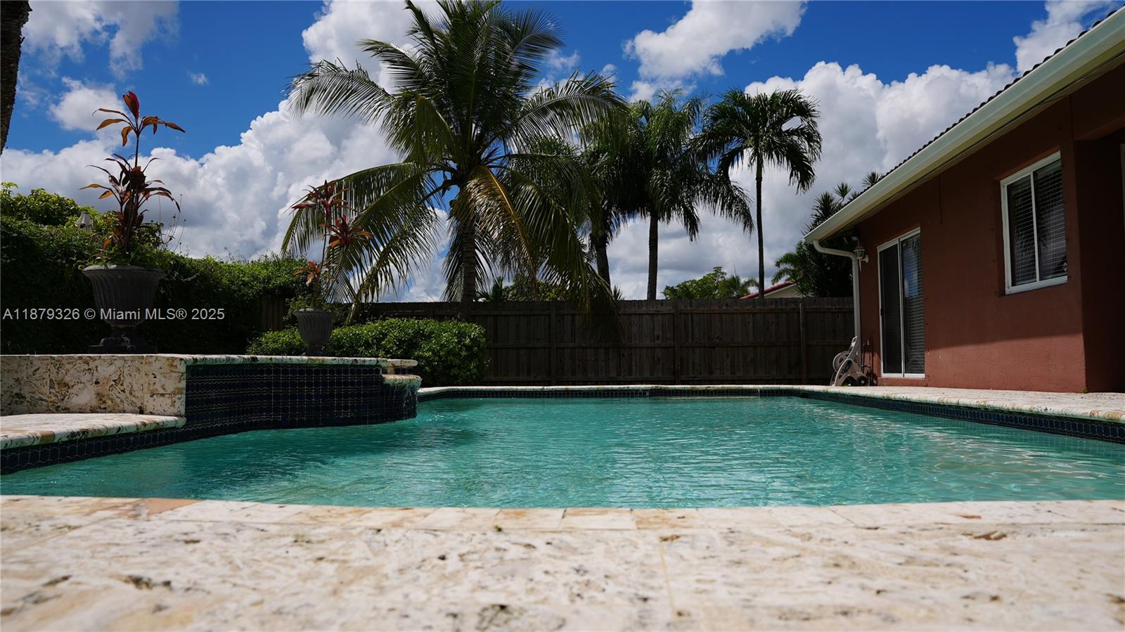 14856 Southwest 174th Street Miami, FL 33187 - Photo 26 of 31 a view of a backyard with potted plants
