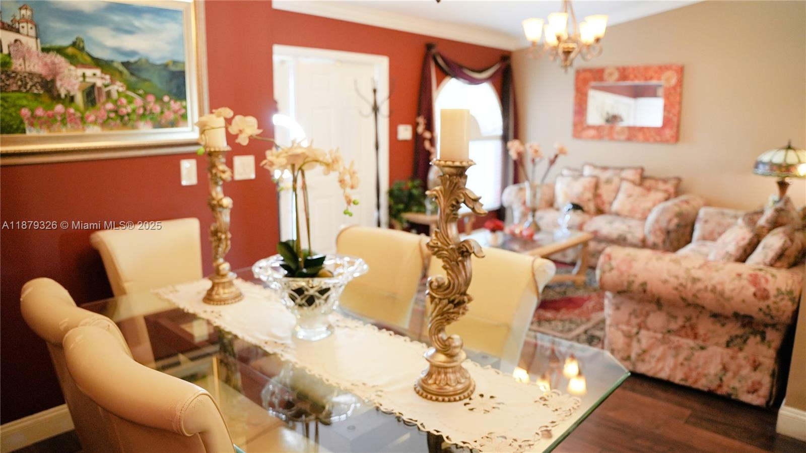14856 Southwest 174th Street Miami, FL 33187 - Photo 3 of 31 a living room with furniture and a large window