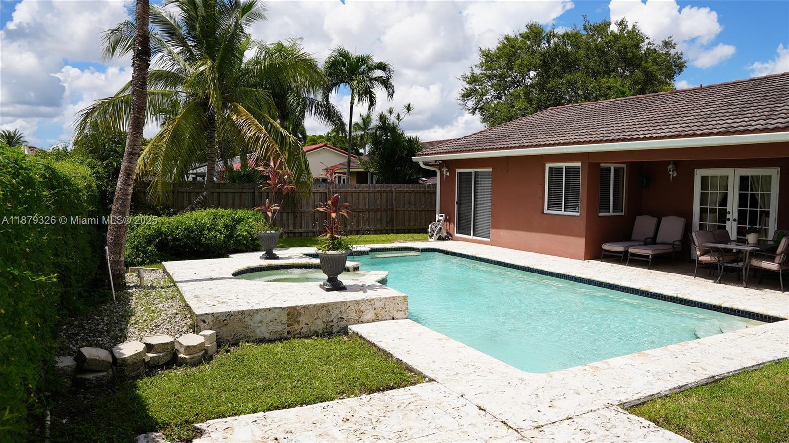14856 Southwest 174th Street Miami, FL 33187 - Photo 31 of 31 a view of a house with backyard and sitting area