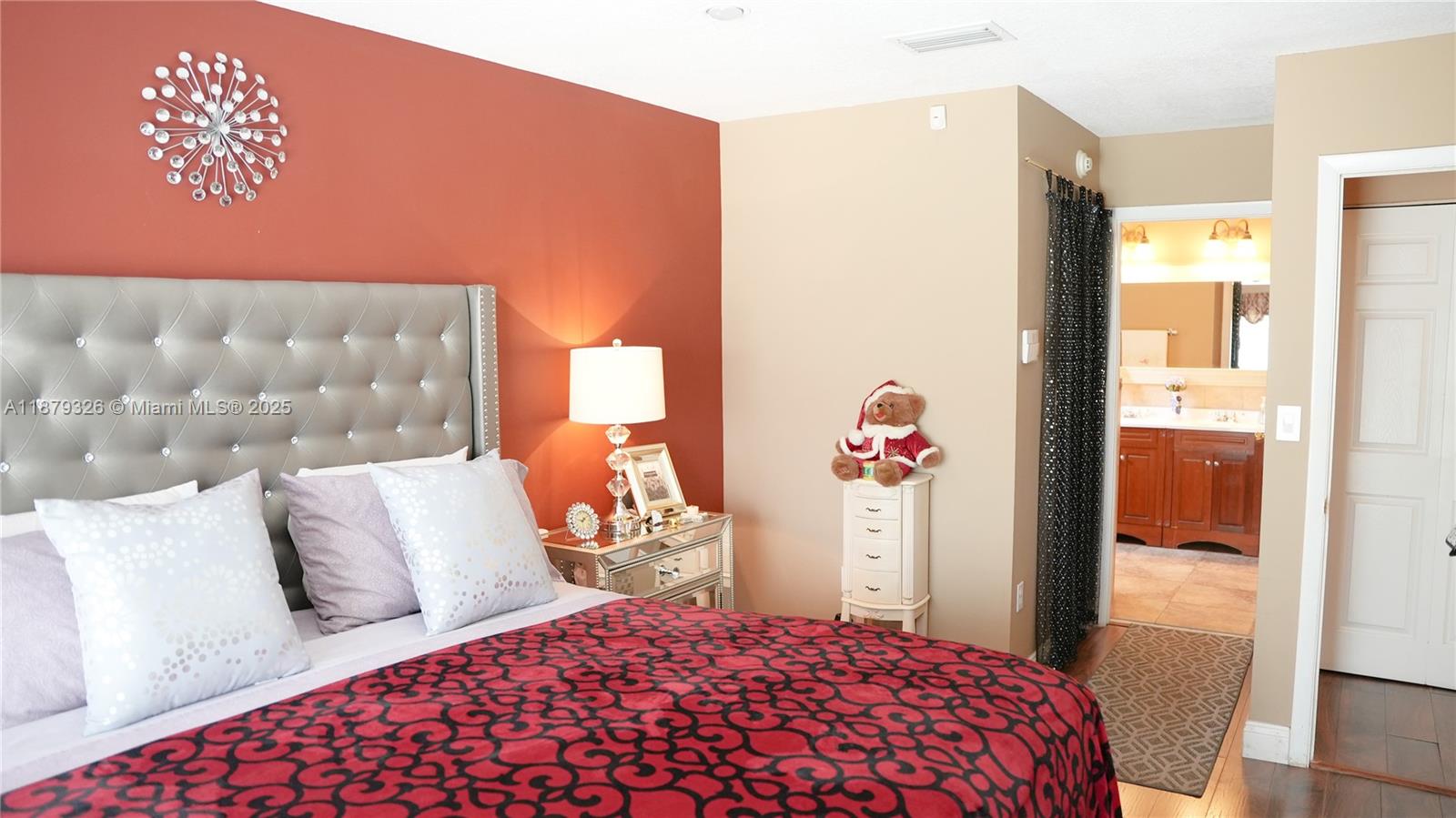 14856 Southwest 174th Street Miami, FL 33187 - Photo 8 of 31 a bedroom with a large bed and a dresser