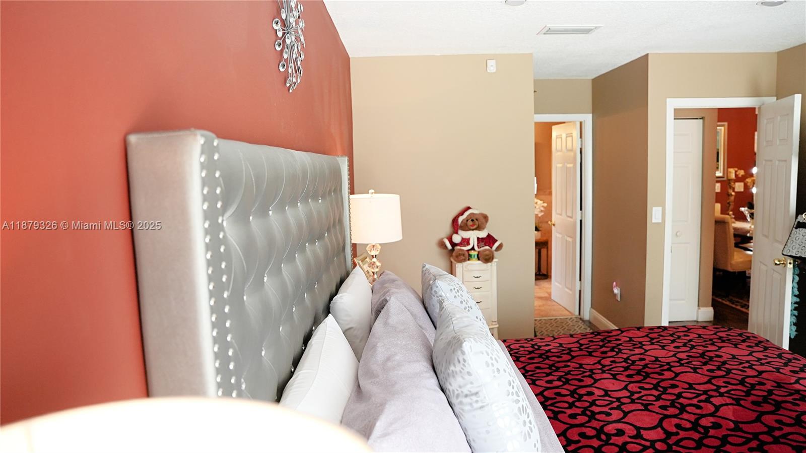 14856 Southwest 174th Street Miami, FL 33187 - Photo 9 of 31 a bedroom with a bed and a couch