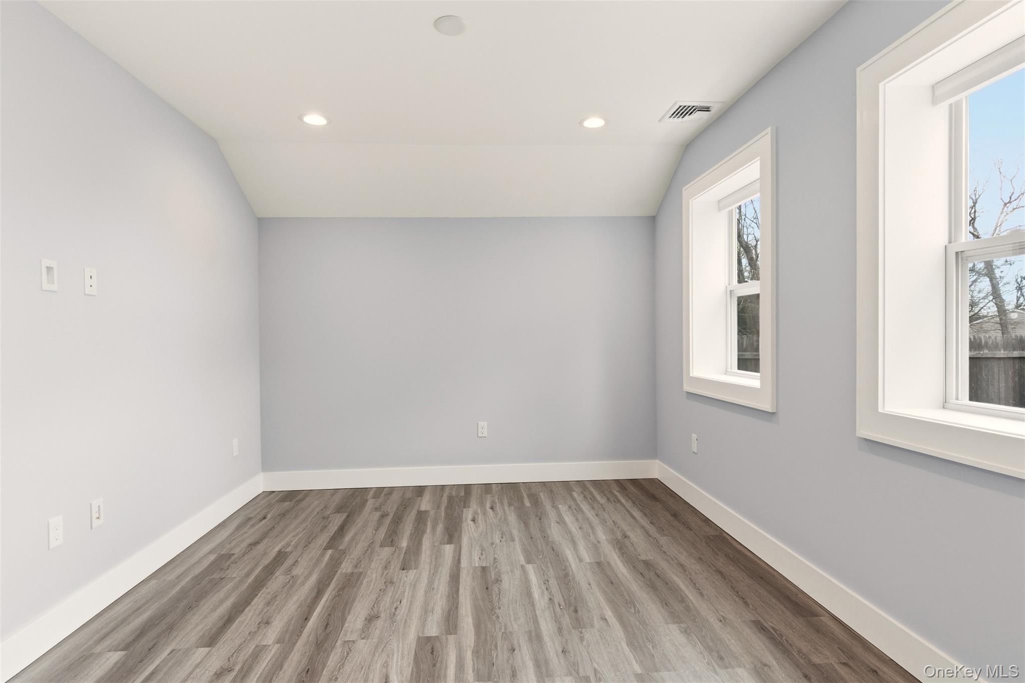 60 Frowein Road Center Moriches, NY 11934 - Photo 11 of 41 wooden floor in an empty room with a window