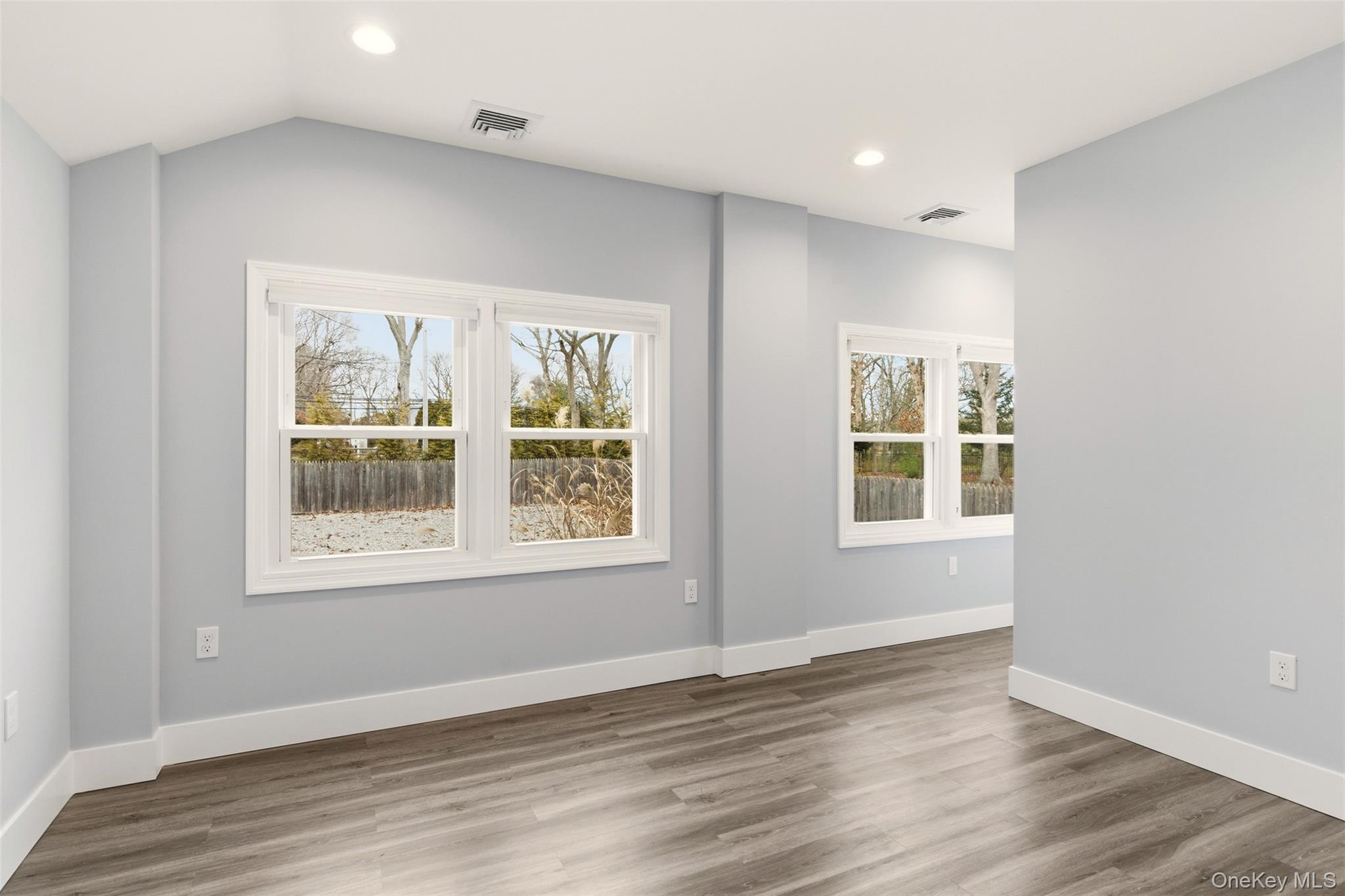 60 Frowein Road Center Moriches, NY 11934 - Photo 14 of 41 an empty room with wooden floor and windows