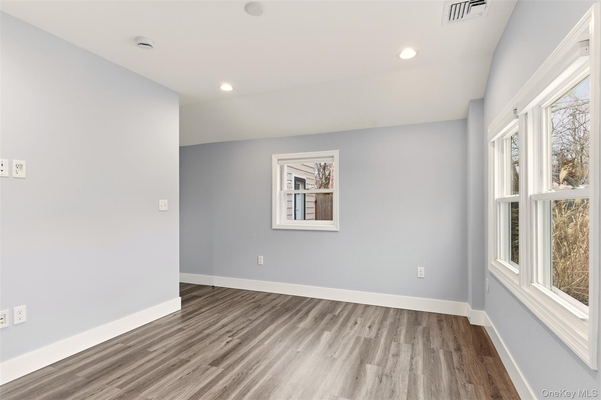 60 Frowein Road Center Moriches, NY 11934 - Photo 15 of 41 a view of an empty room with wooden floor and a window