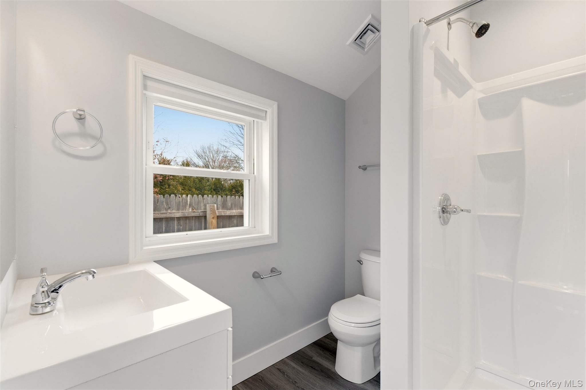 60 Frowein Road Center Moriches, NY 11934 - Photo 16 of 41 a white toilet sitting next to a bathroom sink