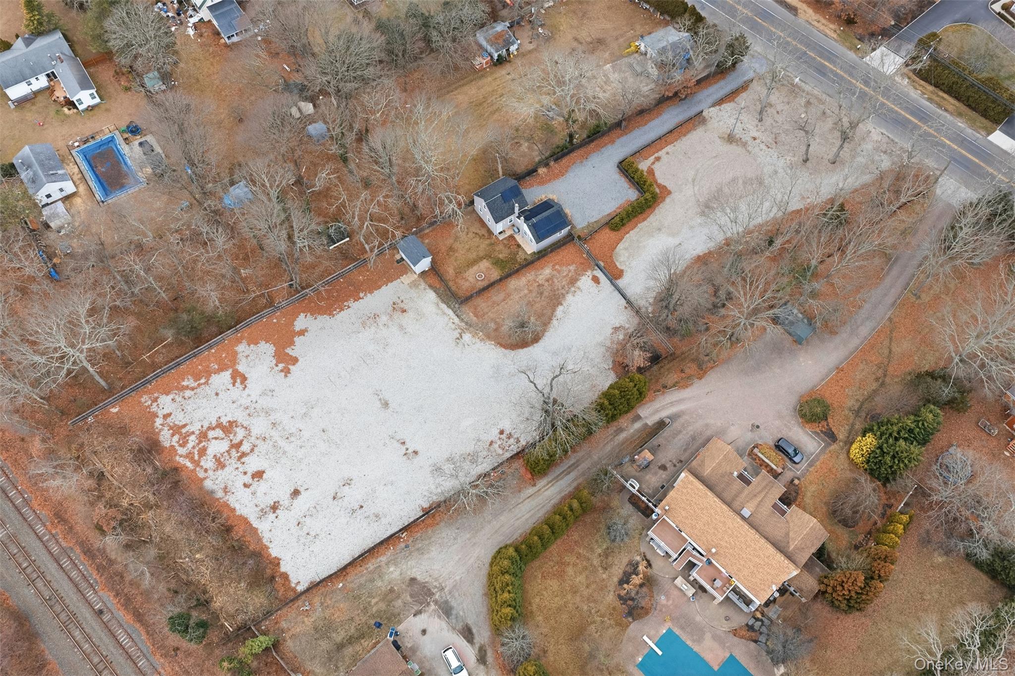60 Frowein Road Center Moriches, NY 11934 - Photo 37 of 41 an aerial view of a house with a yard and wooden deck