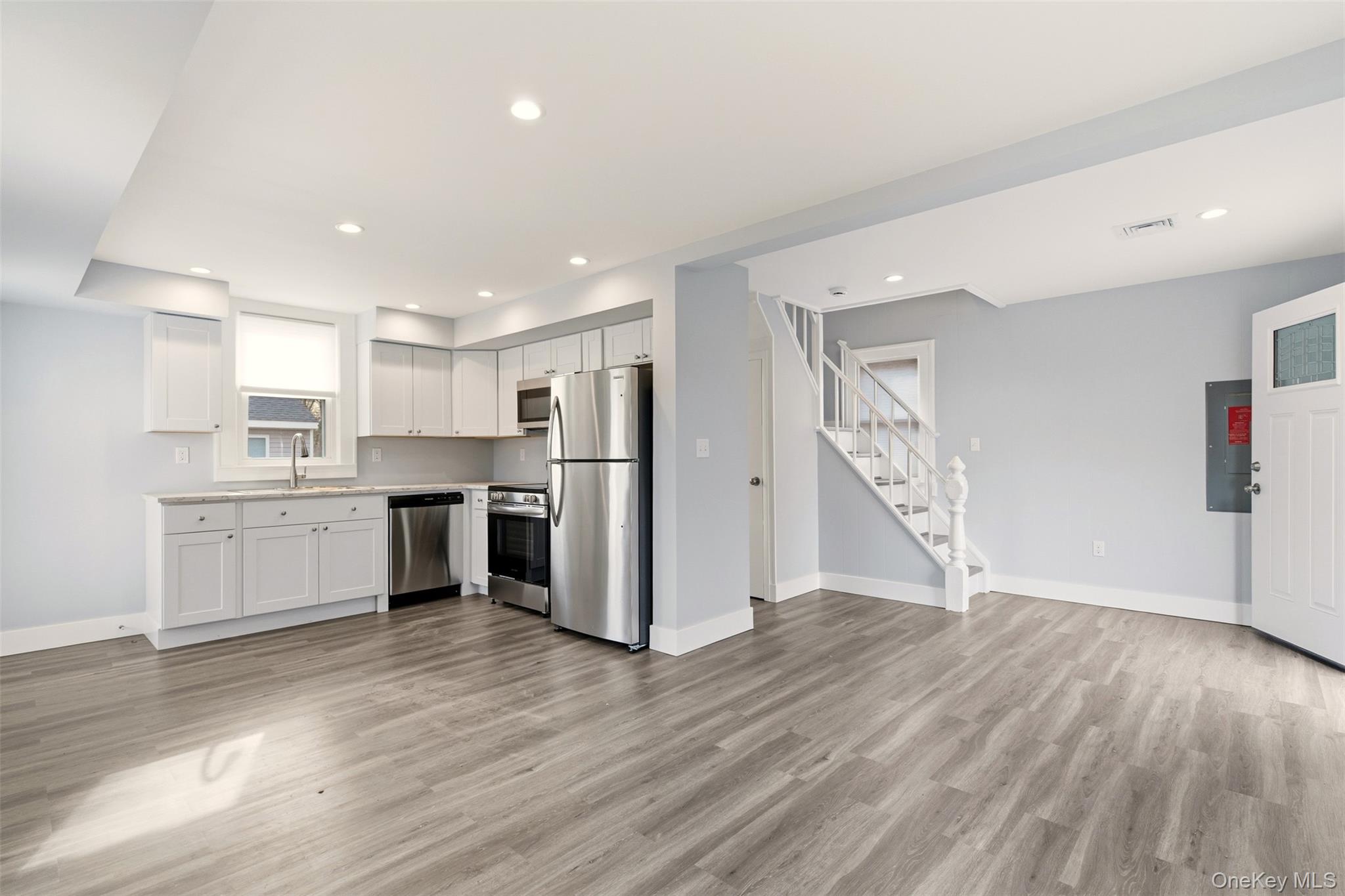 60 Frowein Road Center Moriches, NY 11934 - Photo 6 of 41 a view of kitchen with granite countertop cabinets and refrigerator