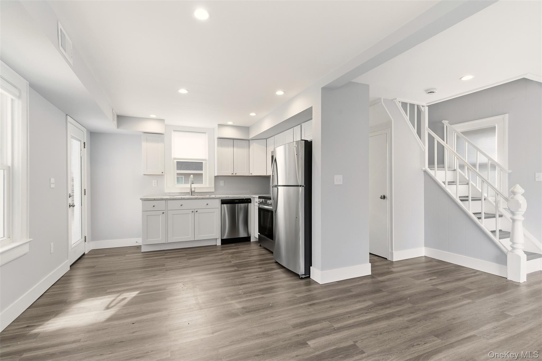 60 Frowein Road Center Moriches, NY 11934 - Photo 7 of 41 a view of a kitchen with wooden floor and electronic appliances