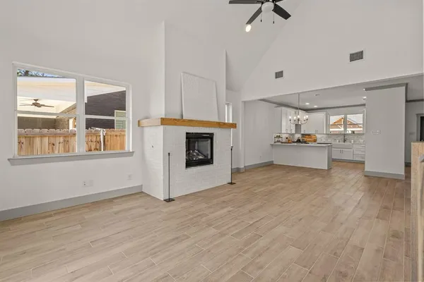 a view of a kitchen with furniture and a fireplace