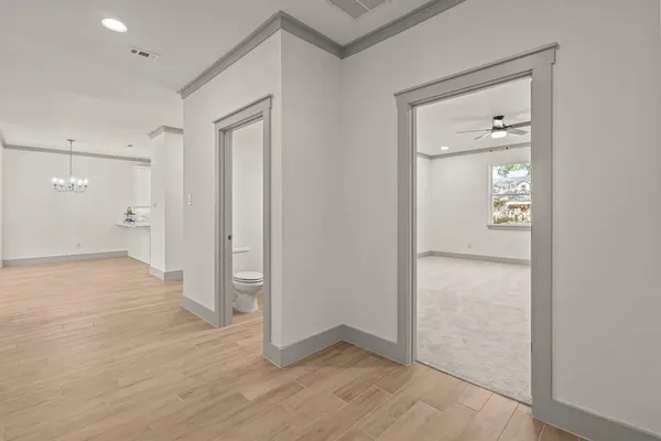 wooden floor with a bathroom