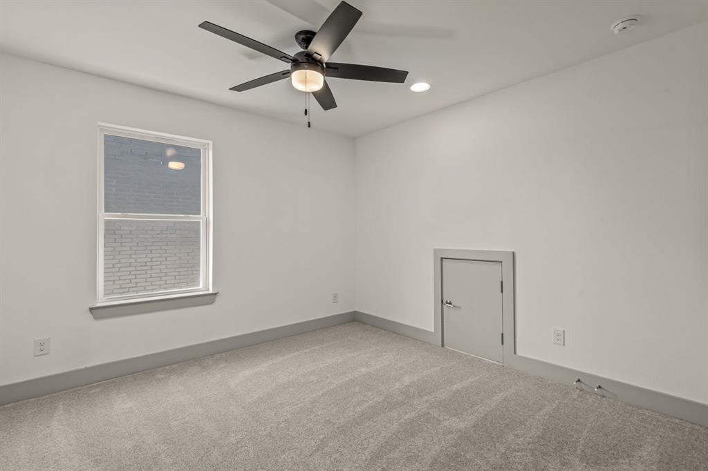 5817 Coleman Street Westworth Village, TX 76114 - Photo 26 of 40 an empty room with windows and fan