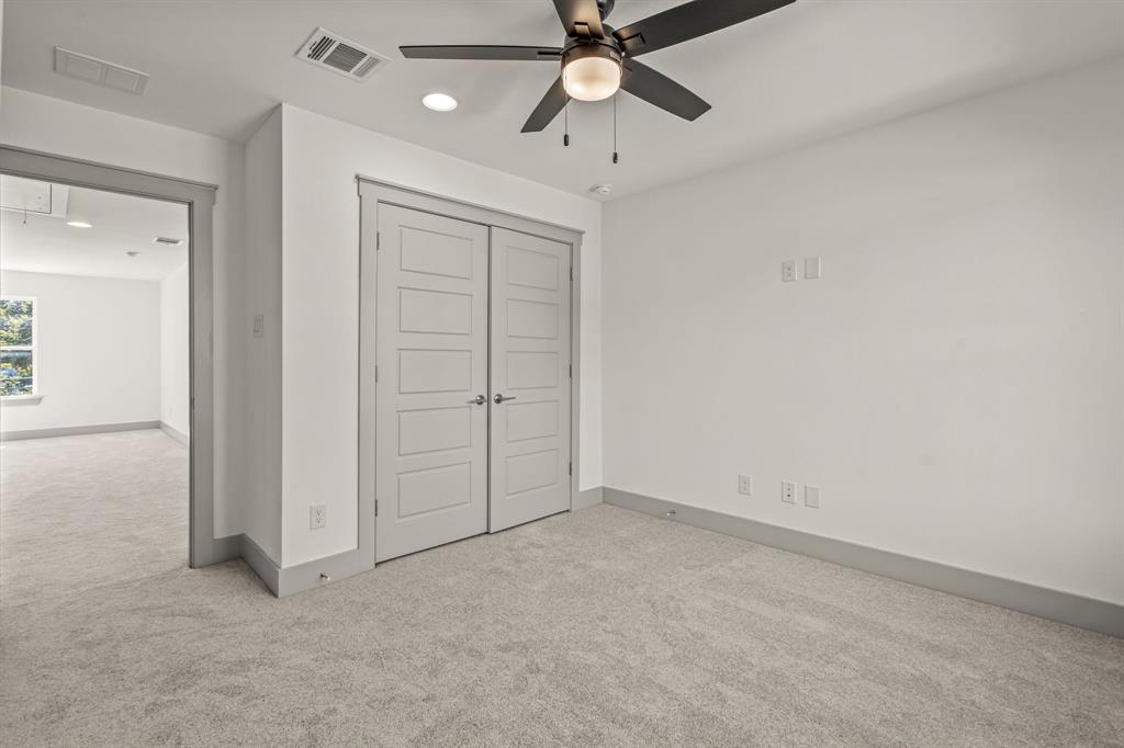 5817 Coleman Street Westworth Village, TX 76114 - Photo 29 of 40 an empty room with chandelier fan