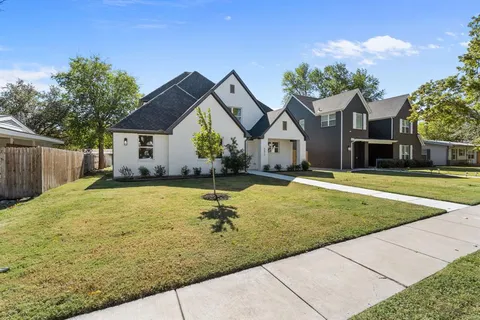 a house with swimming pool in front of it