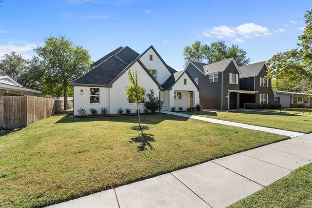 a house with swimming pool in front of it