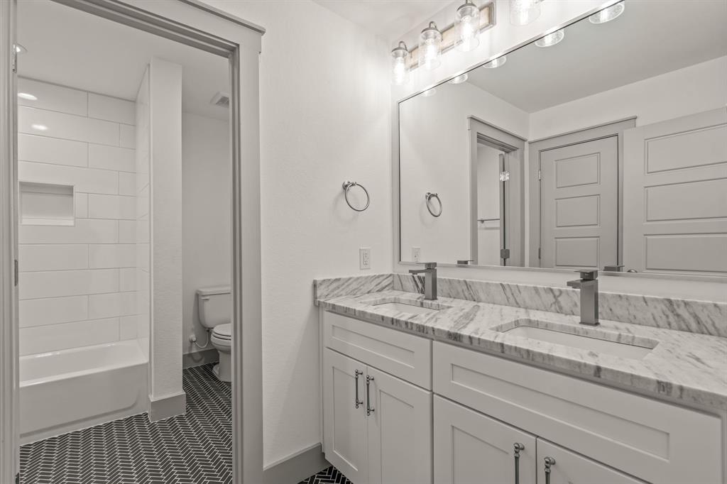 5817 Coleman Street Westworth Village, TX 76114 - Photo 32 of 40 a en suite bathroom with a sink a mirror and a shower