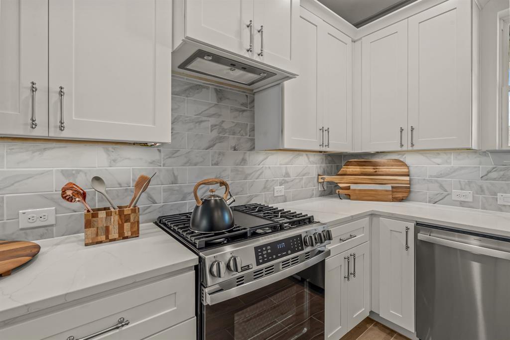 5817 Coleman Street Westworth Village, TX 76114 - Photo 10 of 40 a kitchen with a stove and cabinets