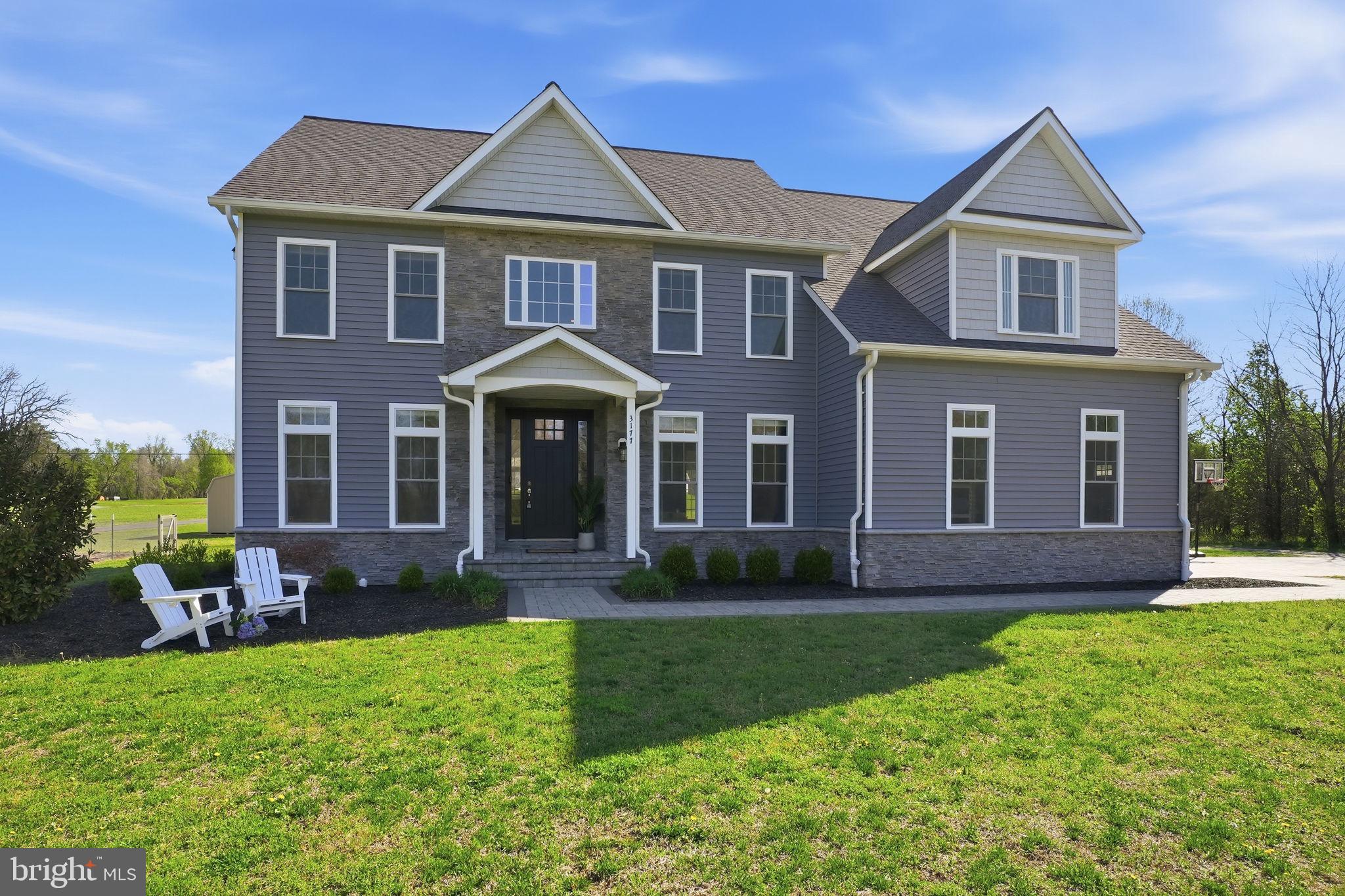 3177 Patuxent River Road Davidsonville, MD 21035 - Photo 1 of 51 front view of brick house with a yard