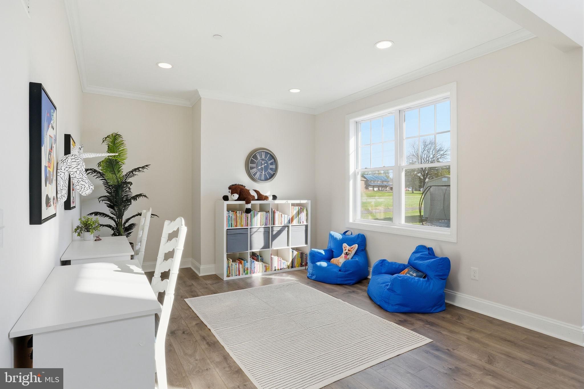 3177 Patuxent River Road Davidsonville, MD 21035 - Photo 14 of 50 a view of a room with gym equipment and potted plants