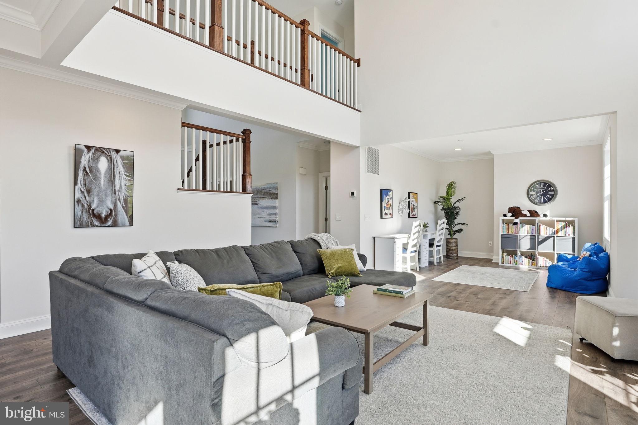 3177 Patuxent River Road Davidsonville, MD 21035 - Photo 16 of 51 a living room with furniture and wooden floor