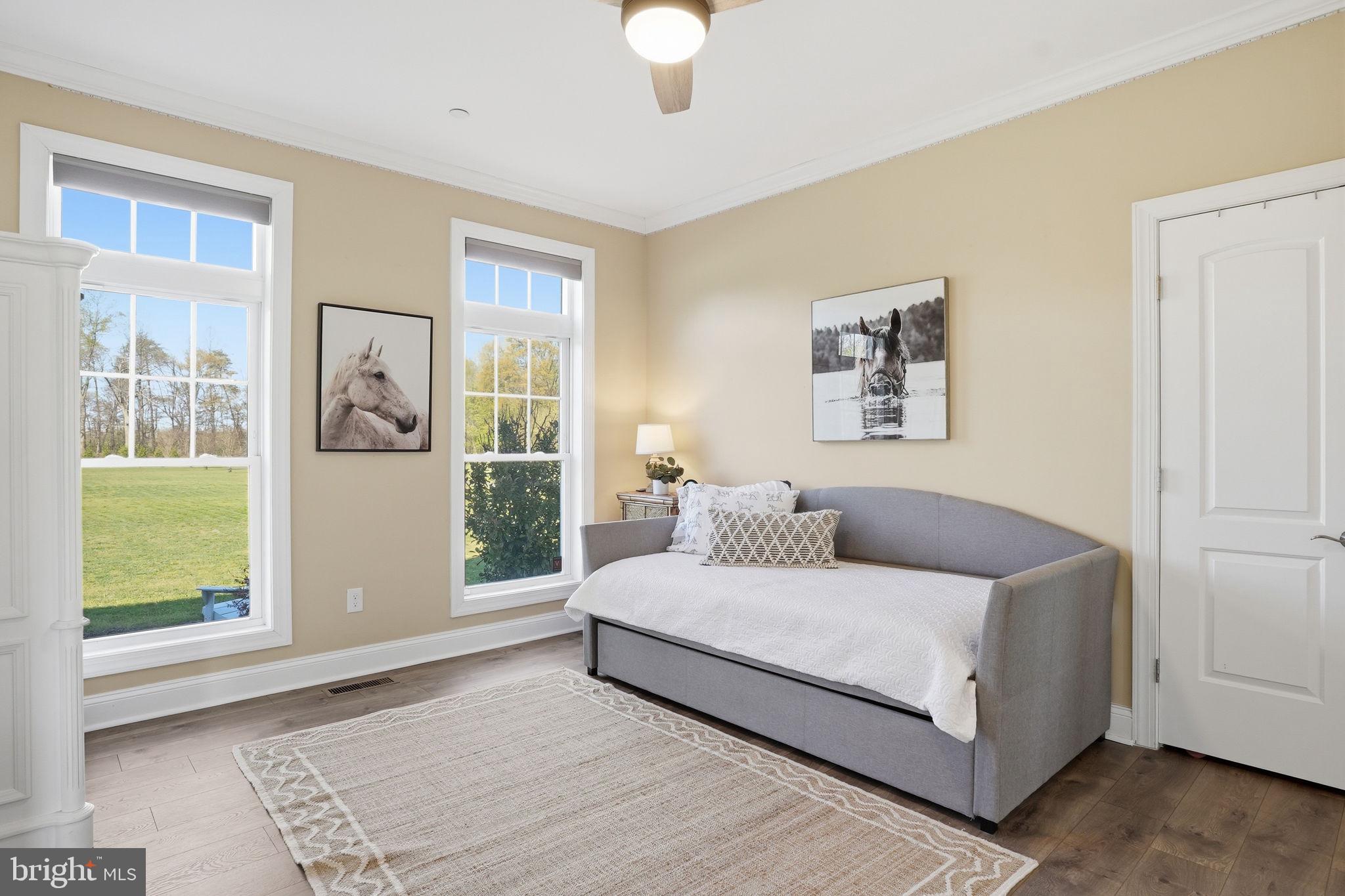 3177 Patuxent River Road Davidsonville, MD 21035 - Photo 16 of 50 a bedroom with a large bed and a window