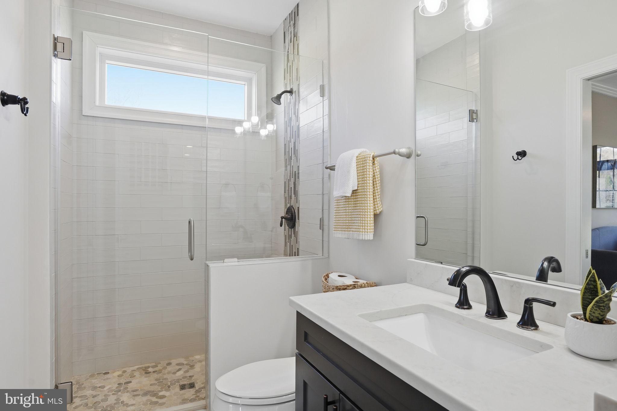 3177 Patuxent River Road Davidsonville, MD 21035 - Photo 17 of 50 a bathroom with a sink toilet and shower