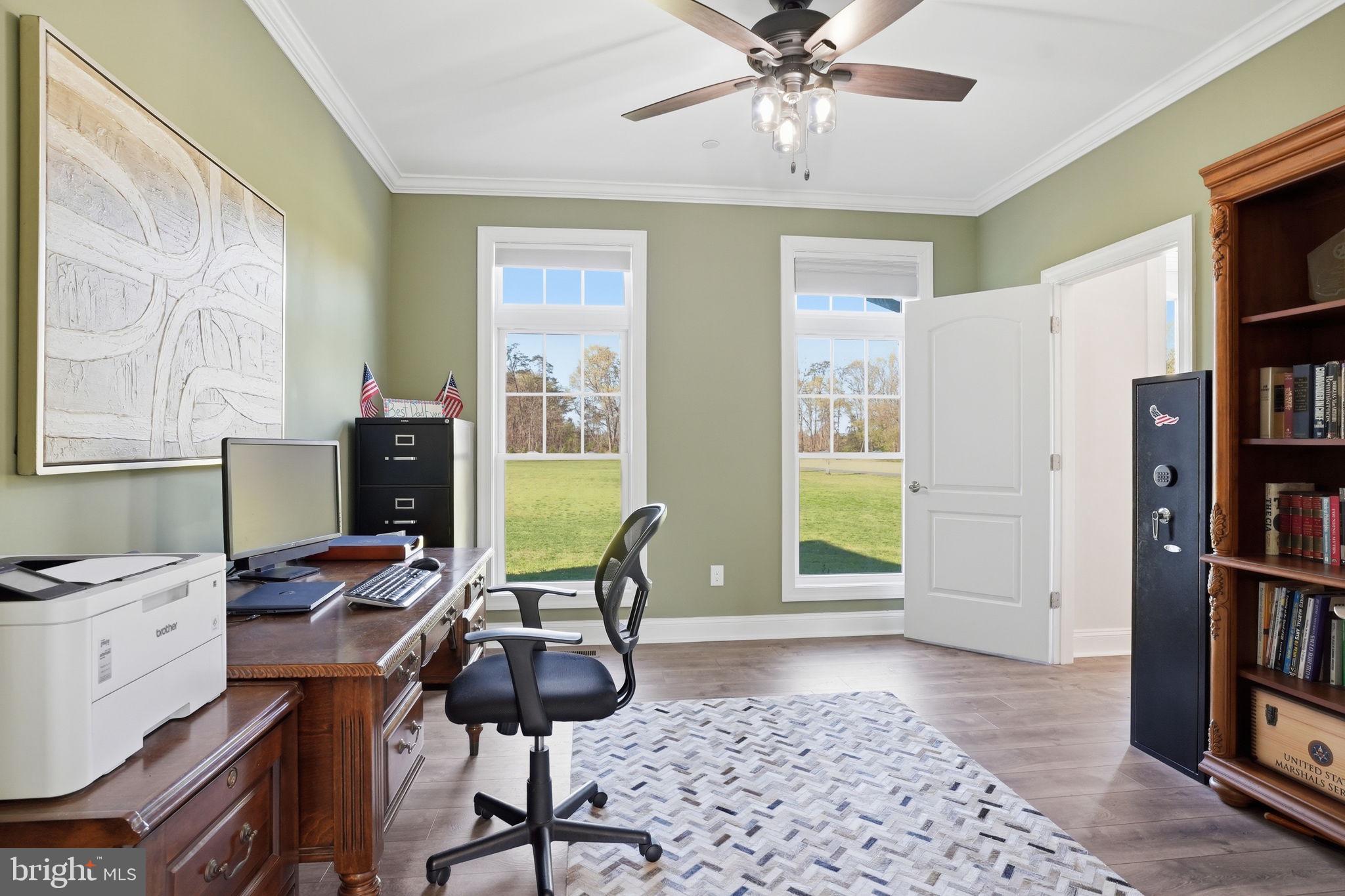 3177 Patuxent River Road Davidsonville, MD 21035 - Photo 18 of 51 a view of a workspace with furniture and a window