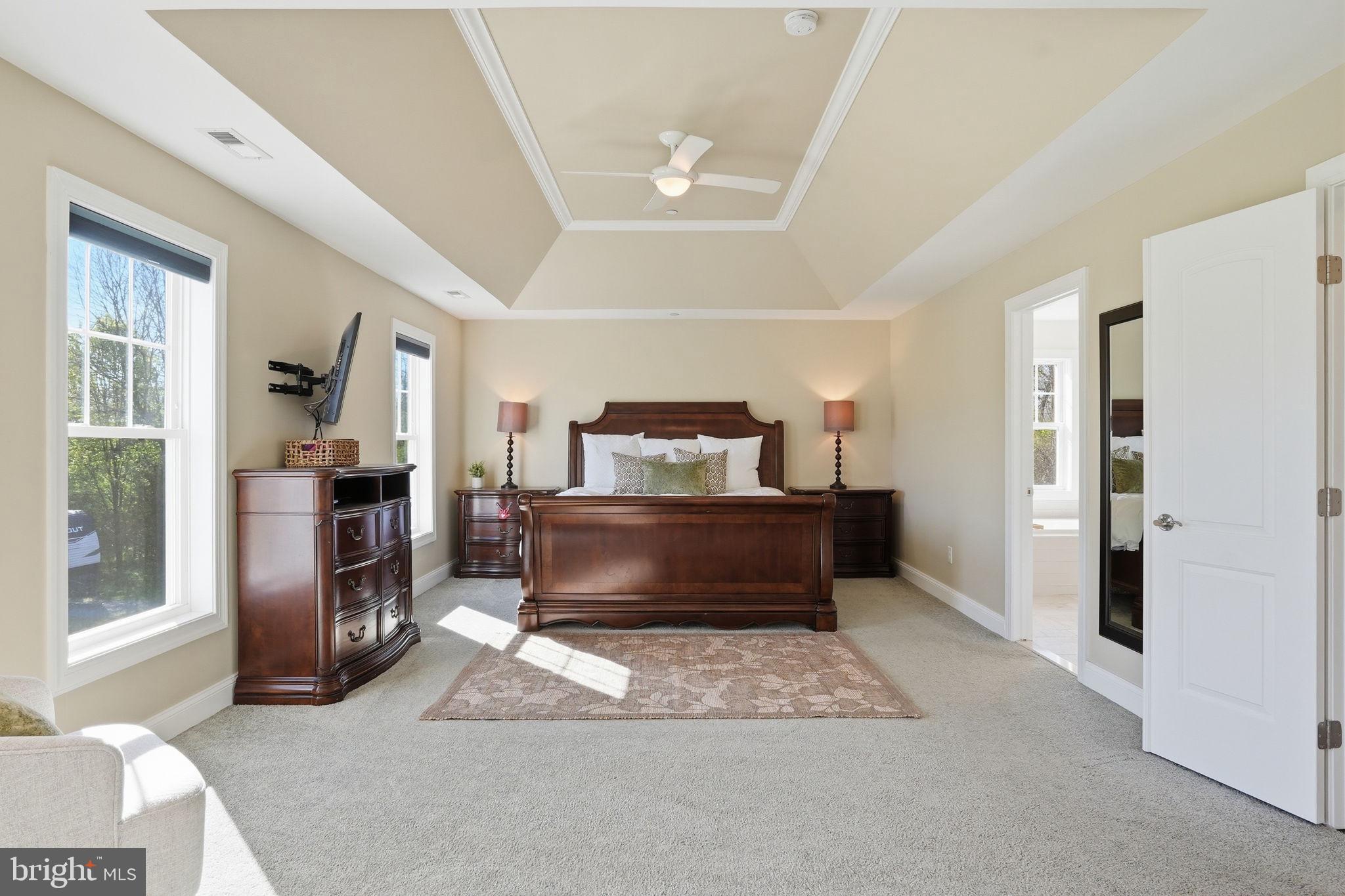 3177 Patuxent River Road Davidsonville, MD 21035 - Photo 19 of 50 a bedroom with a bed and a television