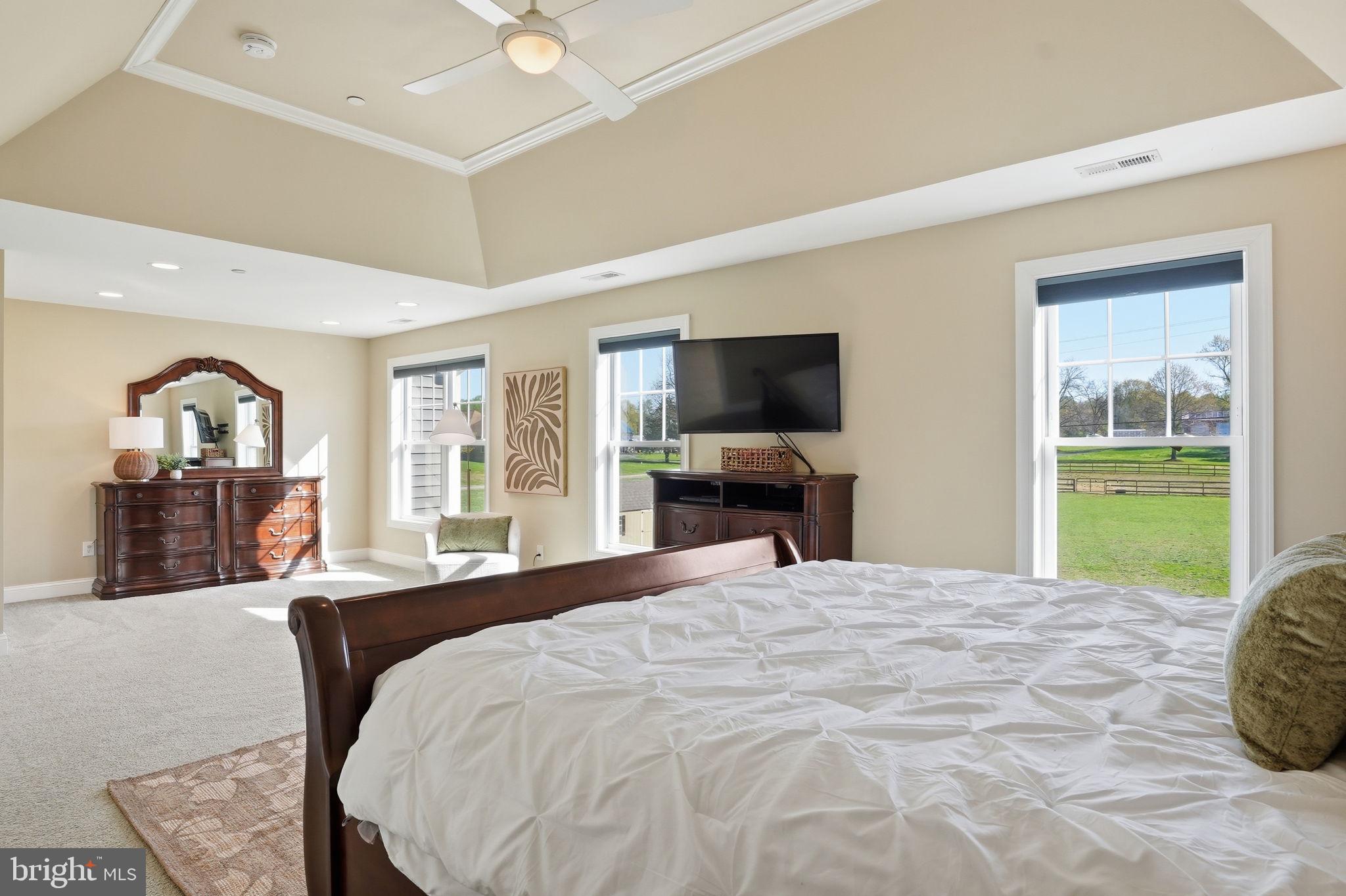 3177 Patuxent River Road Davidsonville, MD 21035 - Photo 20 of 50 a bedroom with a bed and a flat screen tv