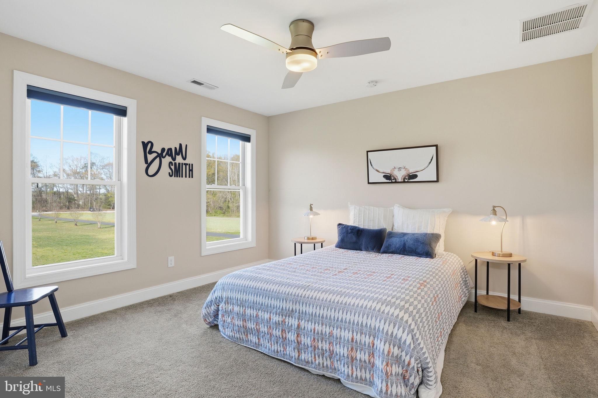 3177 Patuxent River Road Davidsonville, MD 21035 - Photo 24 of 50 a bedroom with a bed and a window