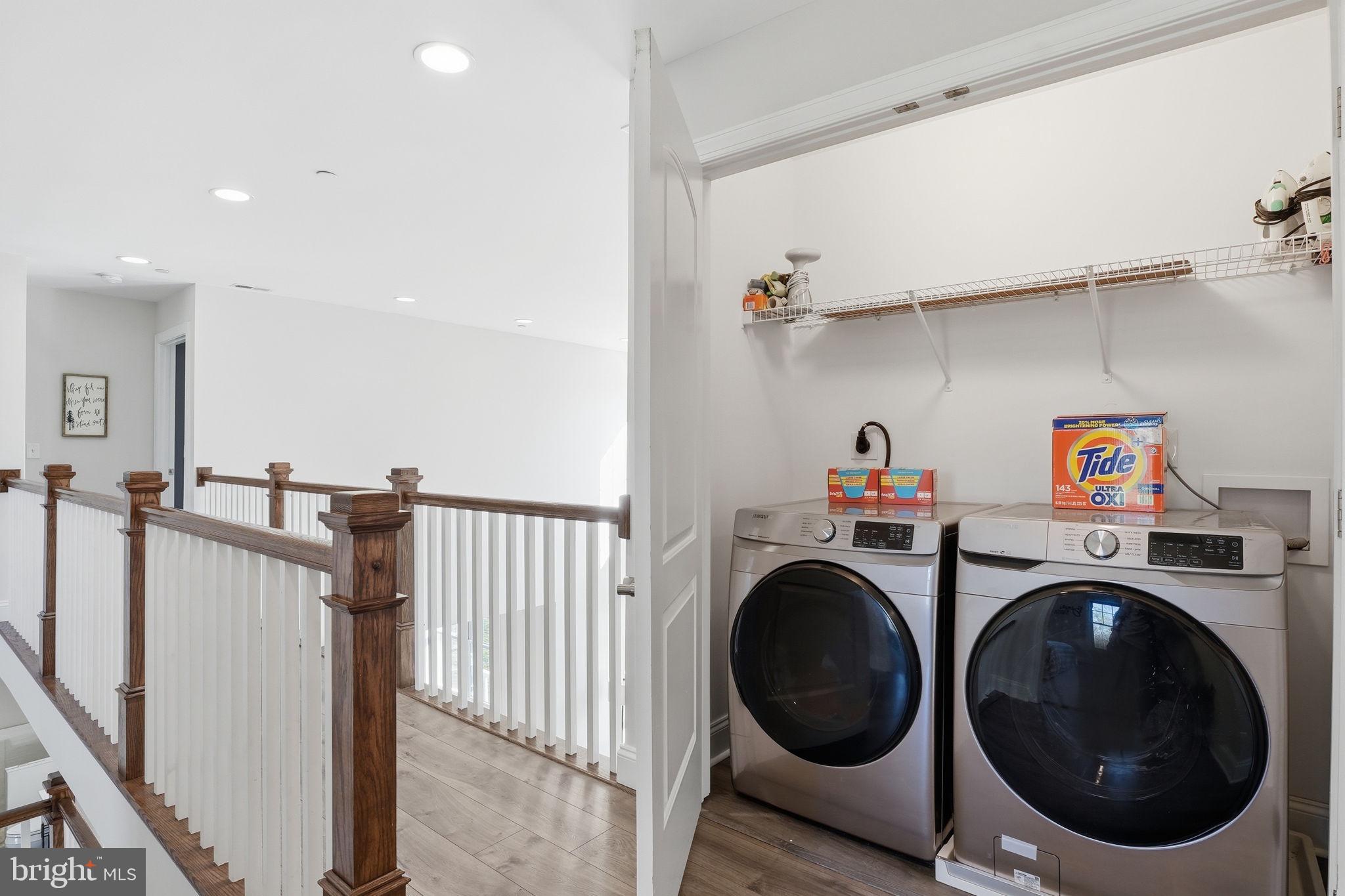 3177 Patuxent River Road Davidsonville, MD 21035 - Photo 29 of 50 a view of a storage & utility room with washer and dryer