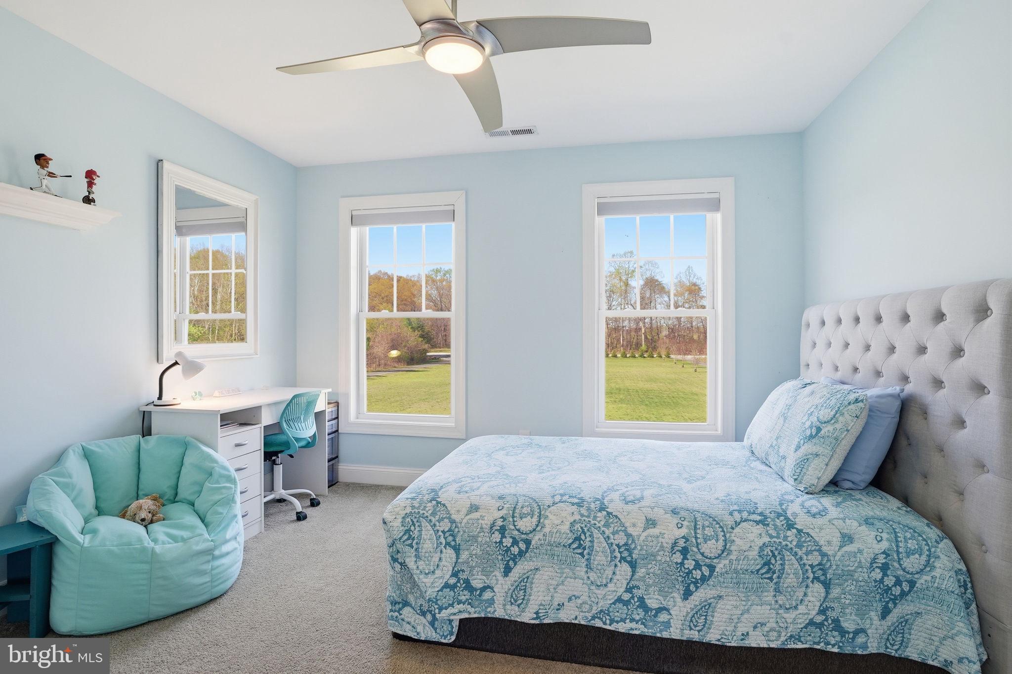 3177 Patuxent River Road Davidsonville, MD 21035 - Photo 31 of 51 a bedroom with a bed couch and window