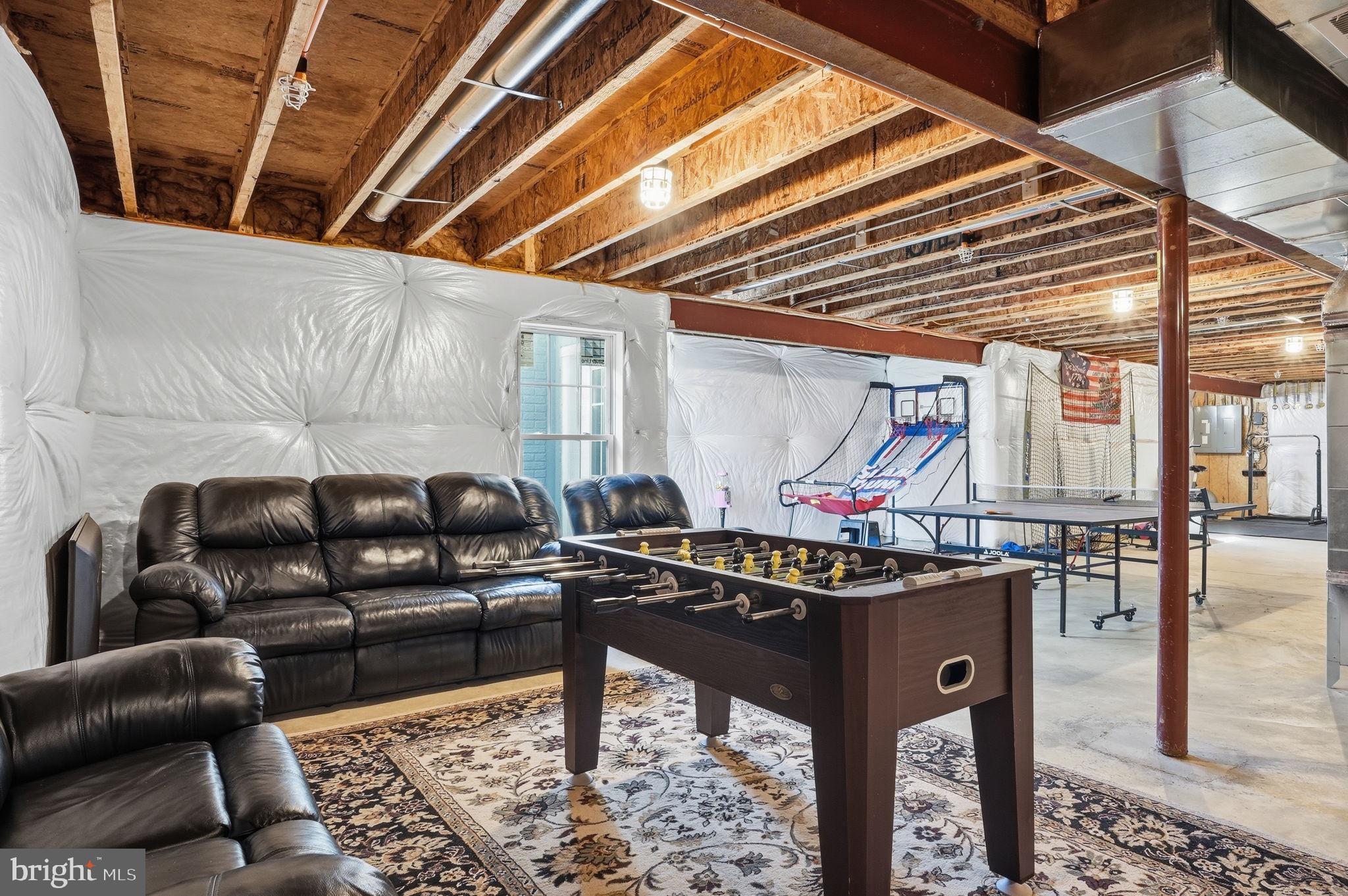 3177 Patuxent River Road Davidsonville, MD 21035 - Photo 33 of 51 a living room with furniture and a table