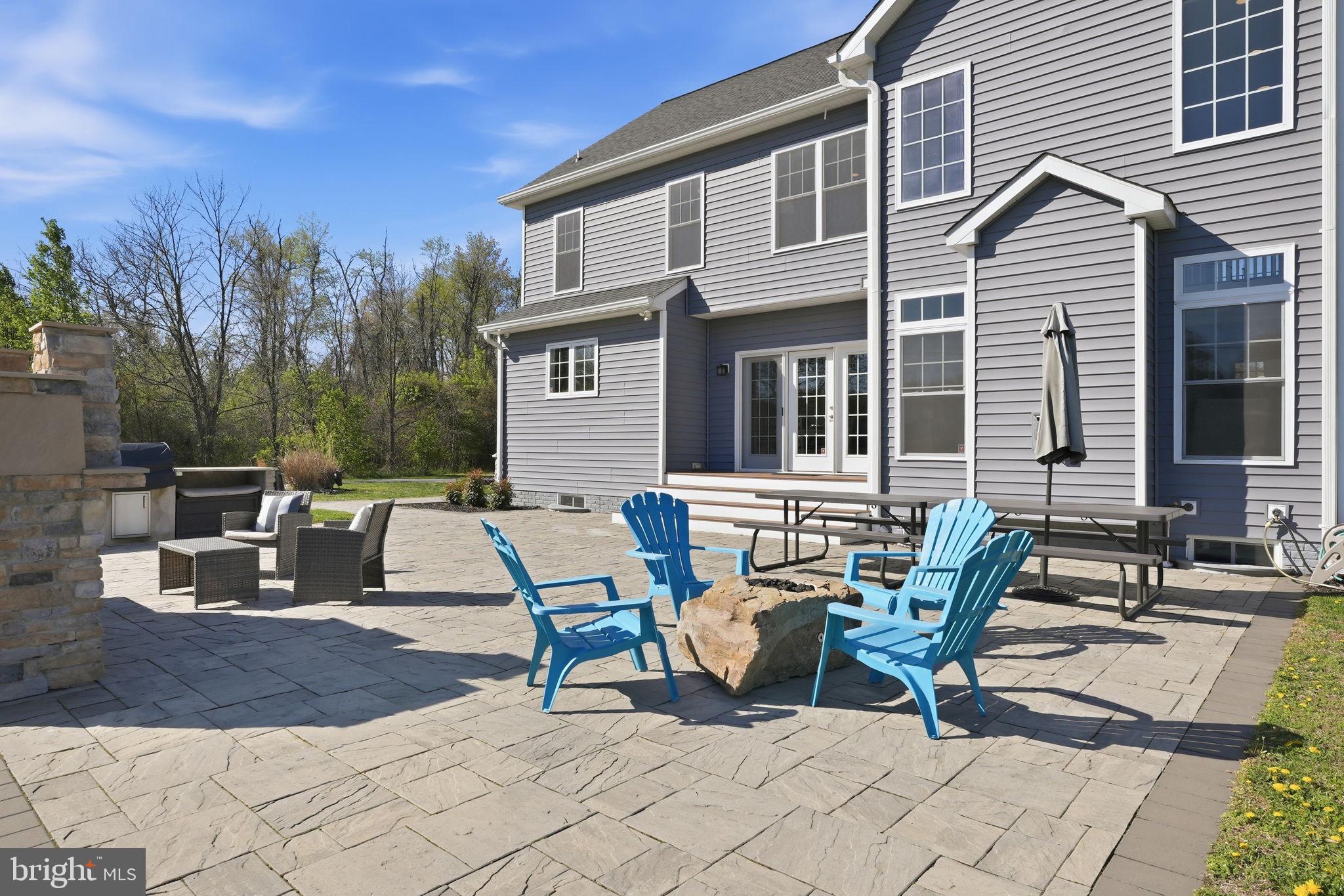 3177 Patuxent River Road Davidsonville, MD 21035 - Photo 34 of 50 a view of a dinning table and chairs in the patio