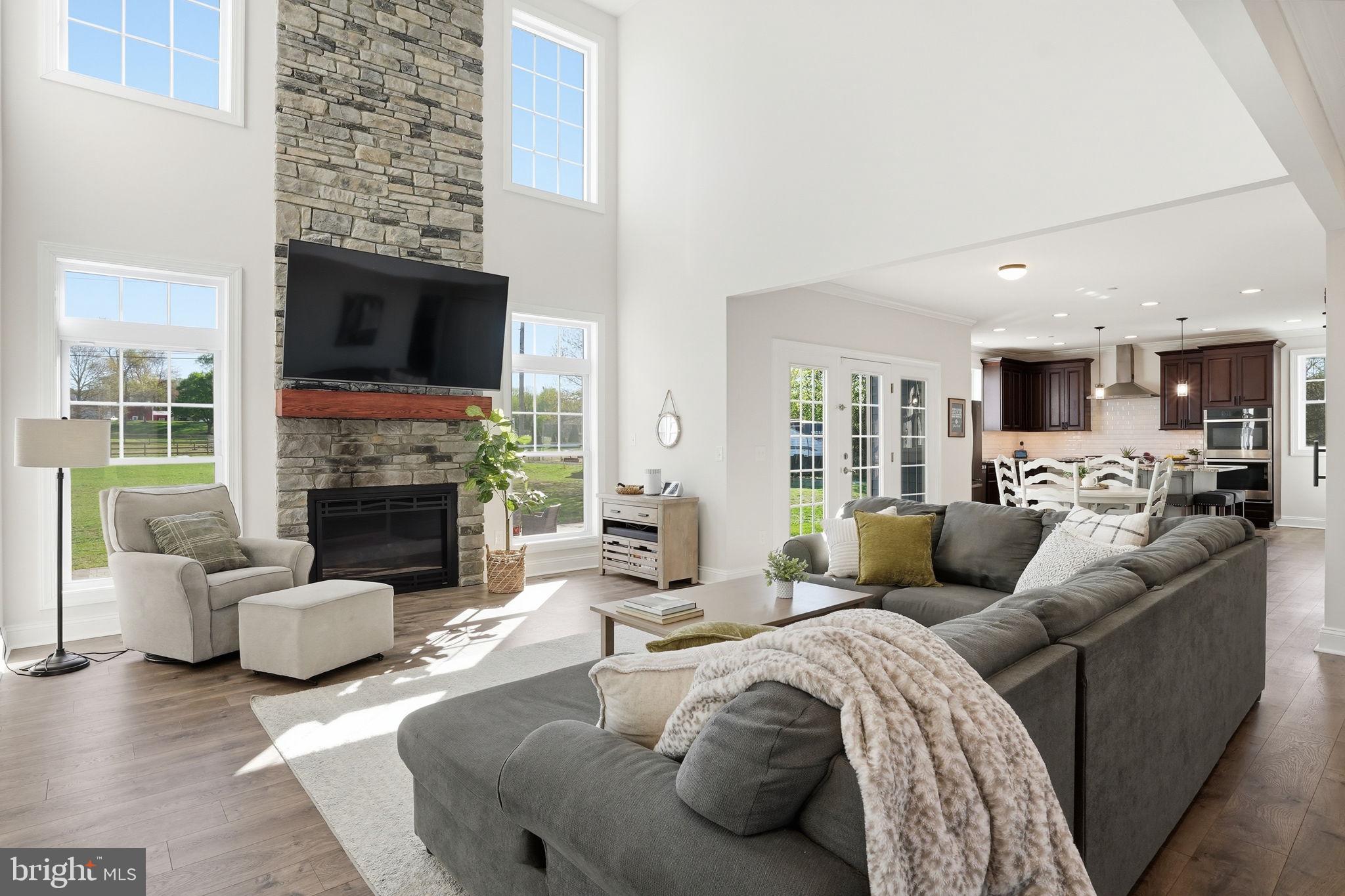 3177 Patuxent River Road Davidsonville, MD 21035 - Photo 8 of 51 a living room with furniture fireplace and a flat screen tv