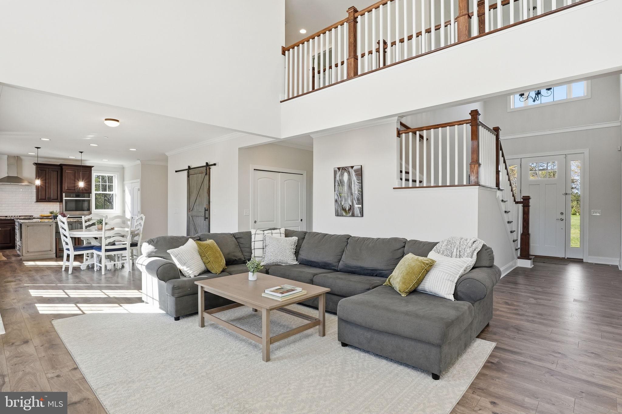 3177 Patuxent River Road Davidsonville, MD 21035 - Photo 10 of 51 a living room with furniture and view of kitchen