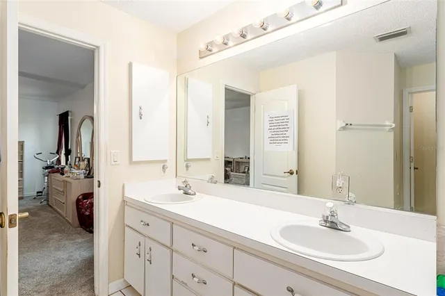a living room with furniture fireplace and a large window
