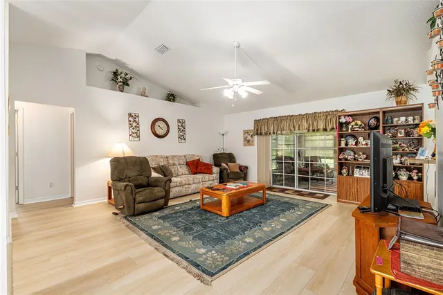 a living room with furniture fireplace and a chandelier