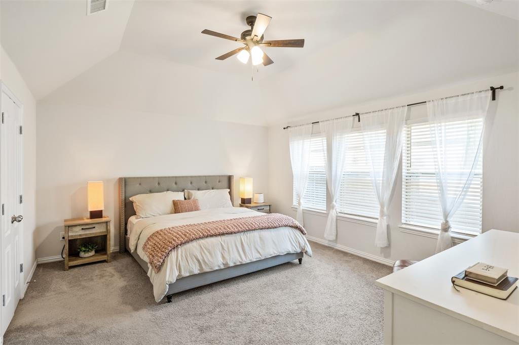 317 Timberline Drive Midlothian, TX 76065 - Photo 12 of 30 a bedroom with a bed and a desk with stool