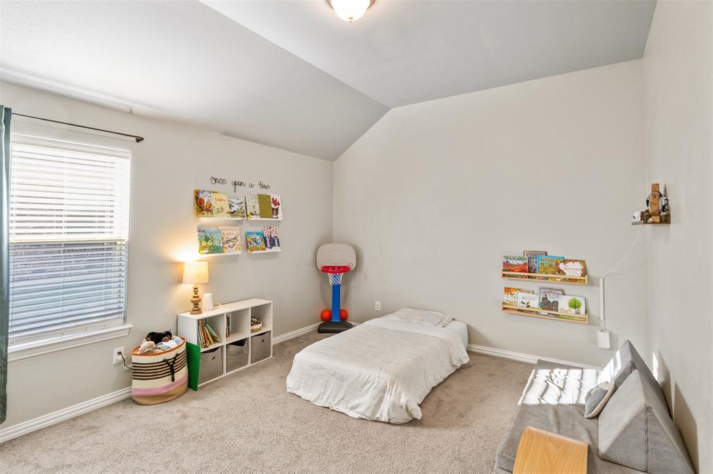 317 Timberline Drive Midlothian, TX 76065 - Photo 17 of 30 a bedroom with a bed and a window