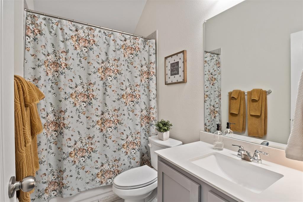 317 Timberline Drive Midlothian, TX 76065 - Photo 19 of 30 a bathroom with a sink toilet and shower