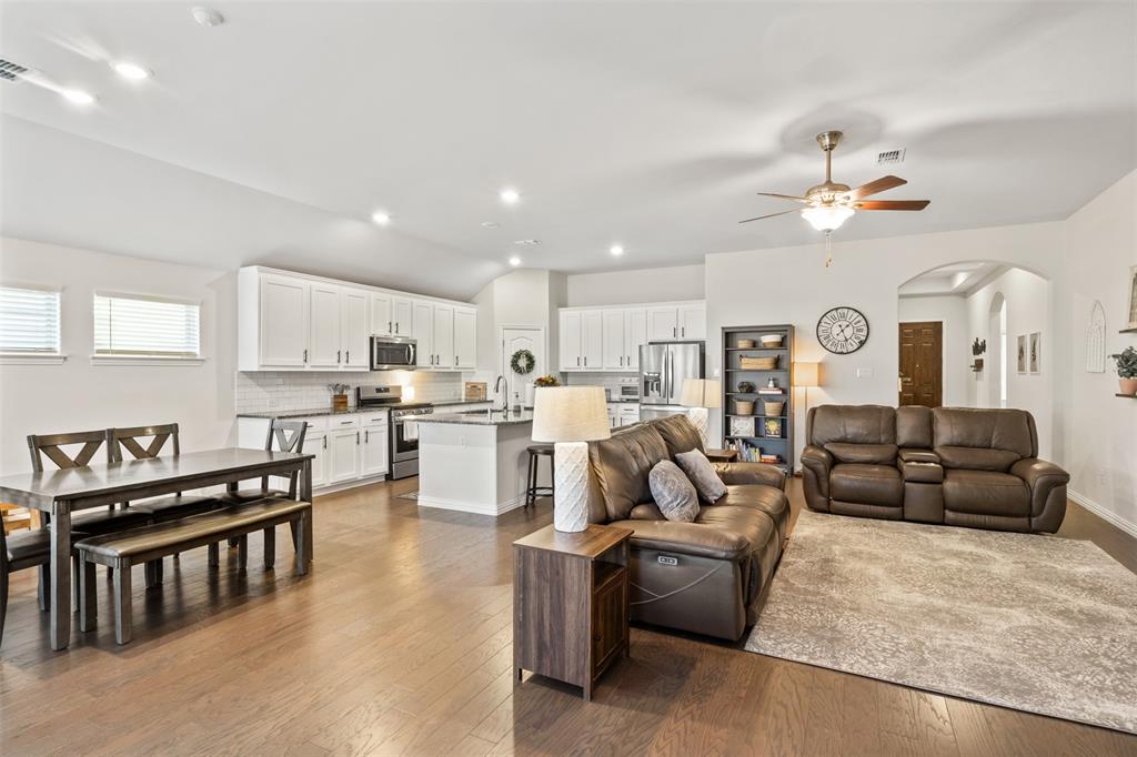 317 Timberline Drive Midlothian, TX 76065 - Photo 8 of 30 a living room with furniture kitchen view and a chandelier