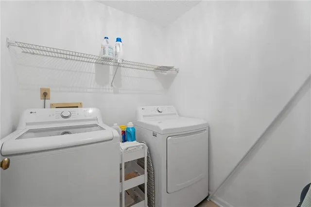 a utility room with dryer and washer