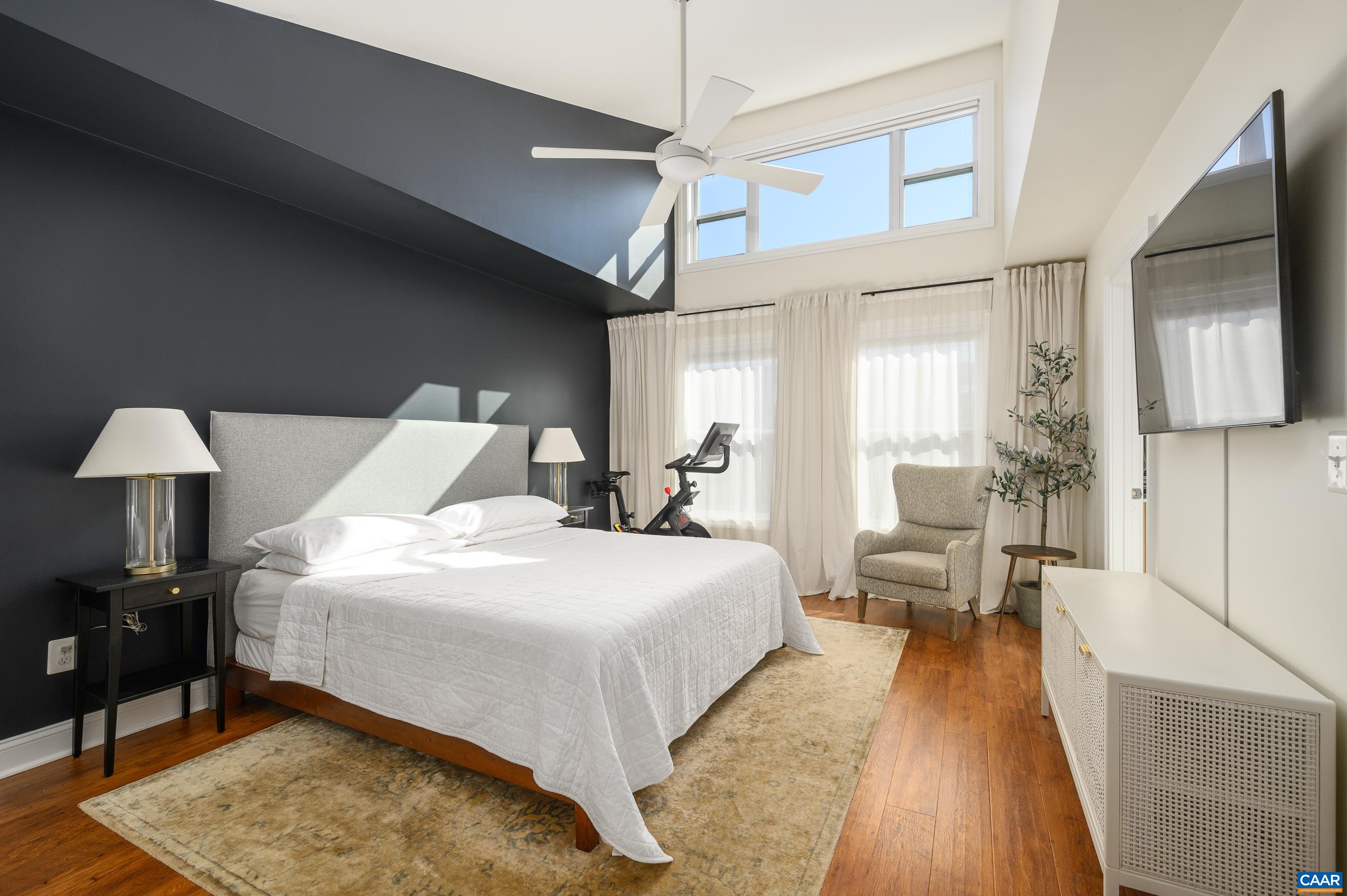 147 Junction Lane Charlottesville, VA 22902 - Photo 13 of 30 a bedroom with a bed and wooden floor