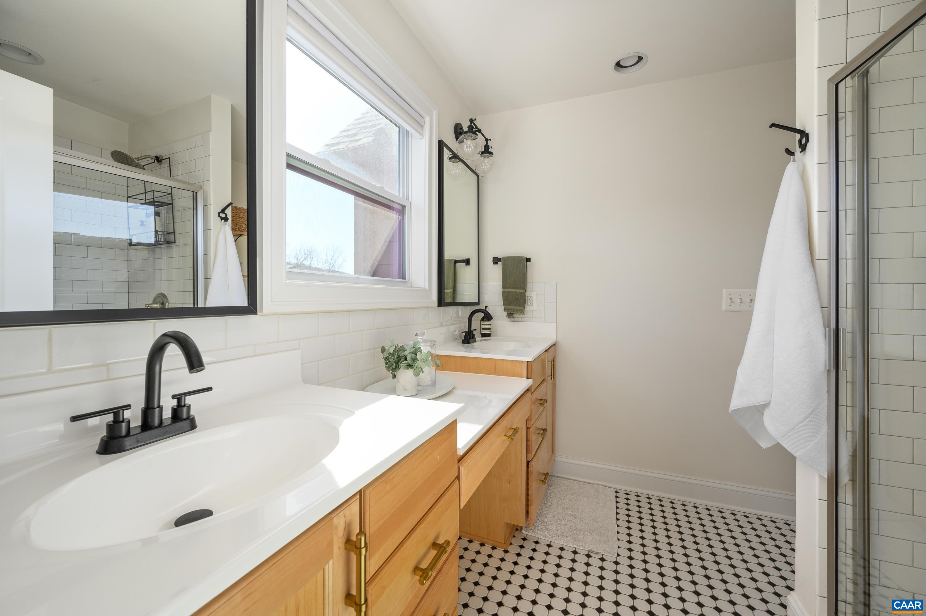 147 Junction Lane Charlottesville, VA 22902 - Photo 14 of 30 a bathroom with a sink a toilet and a mirror