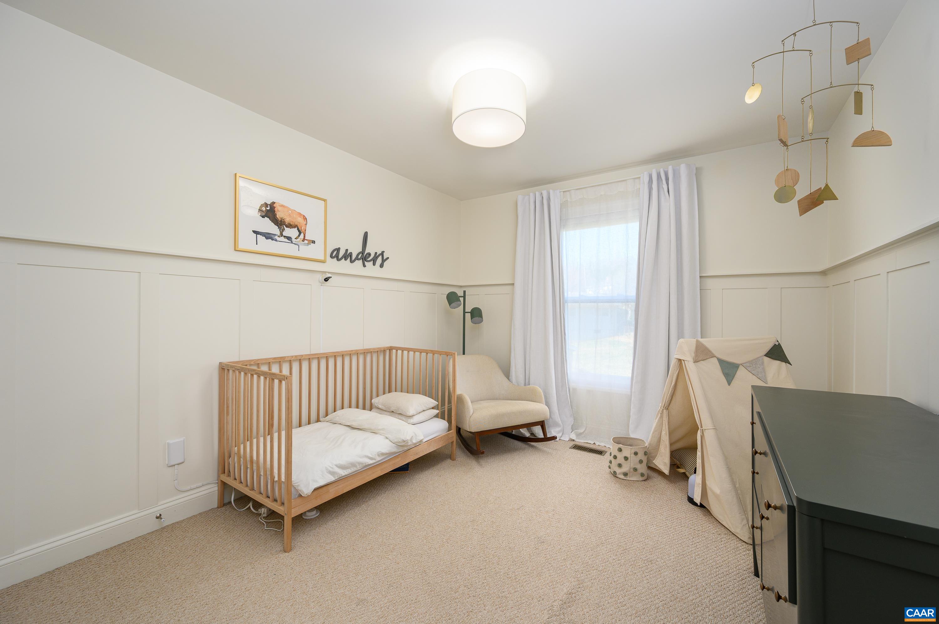 147 Junction Lane Charlottesville, VA 22902 - Photo 16 of 30 a spacious bedroom with a bed and a window