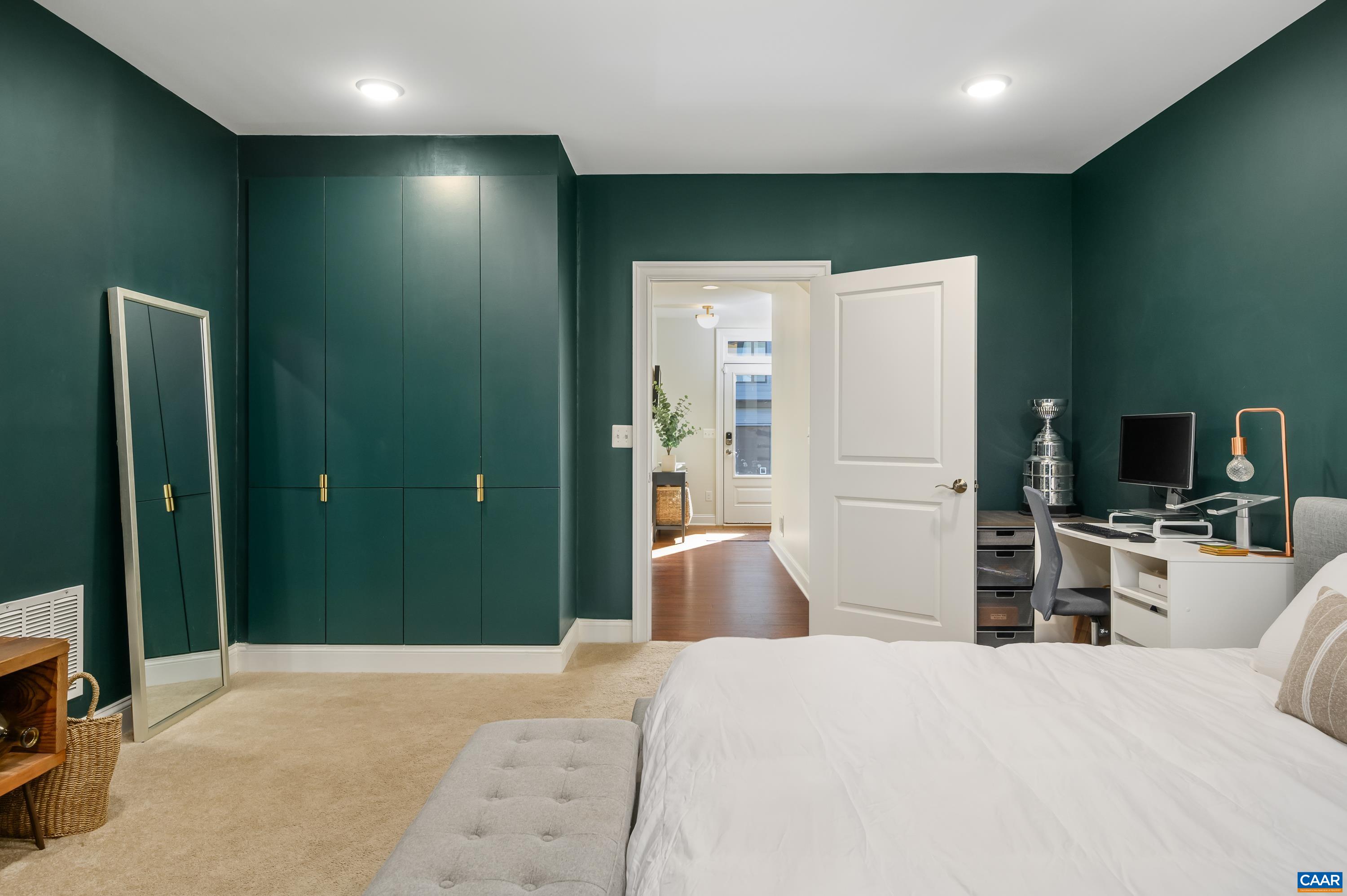 147 Junction Lane Charlottesville, VA 22902 - Photo 20 of 30 a bedroom with a bed and a large mirror