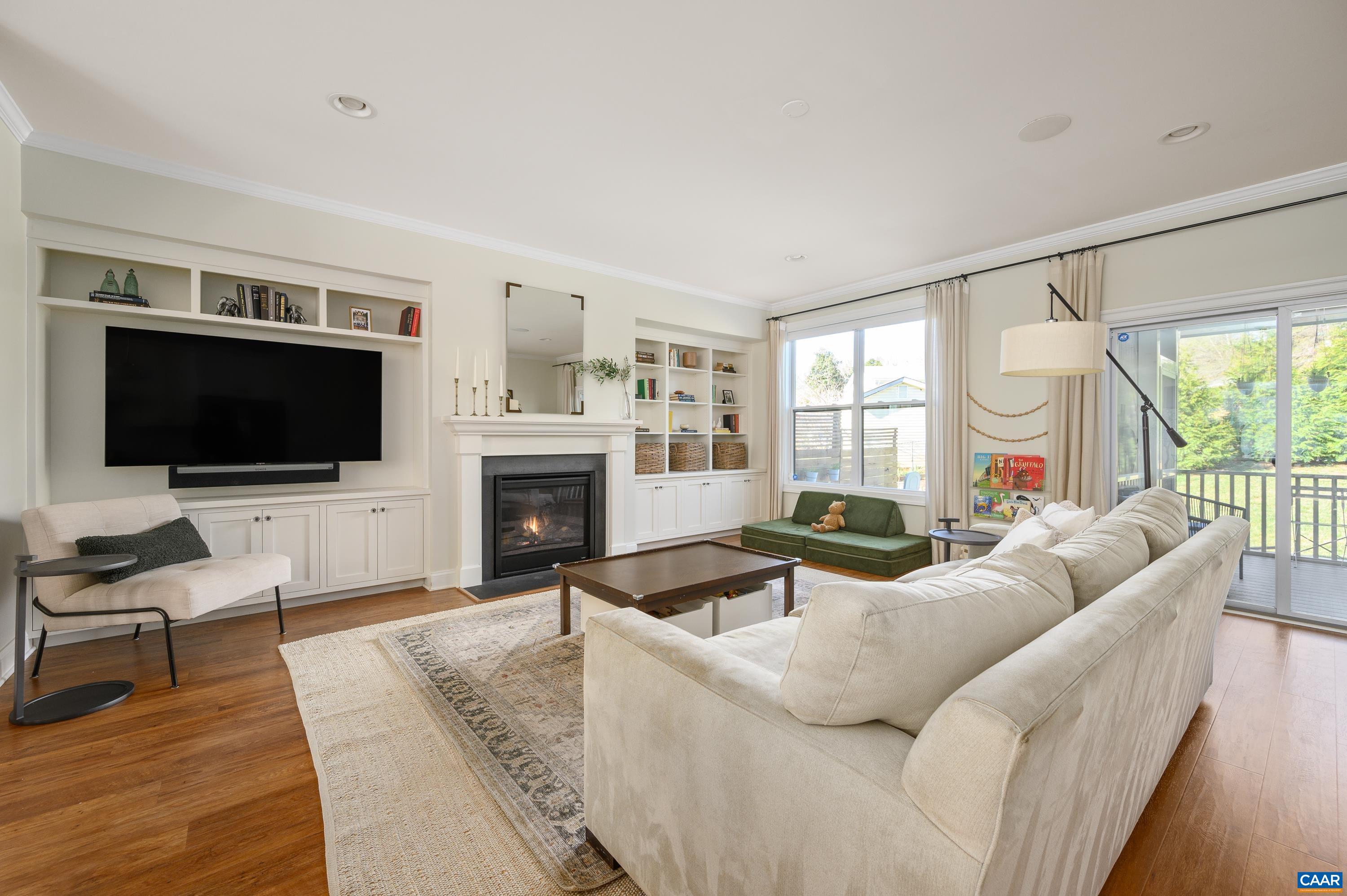 147 Junction Lane Charlottesville, VA 22902 - Photo 7 of 30 a living room with furniture a flat screen tv and a fireplace