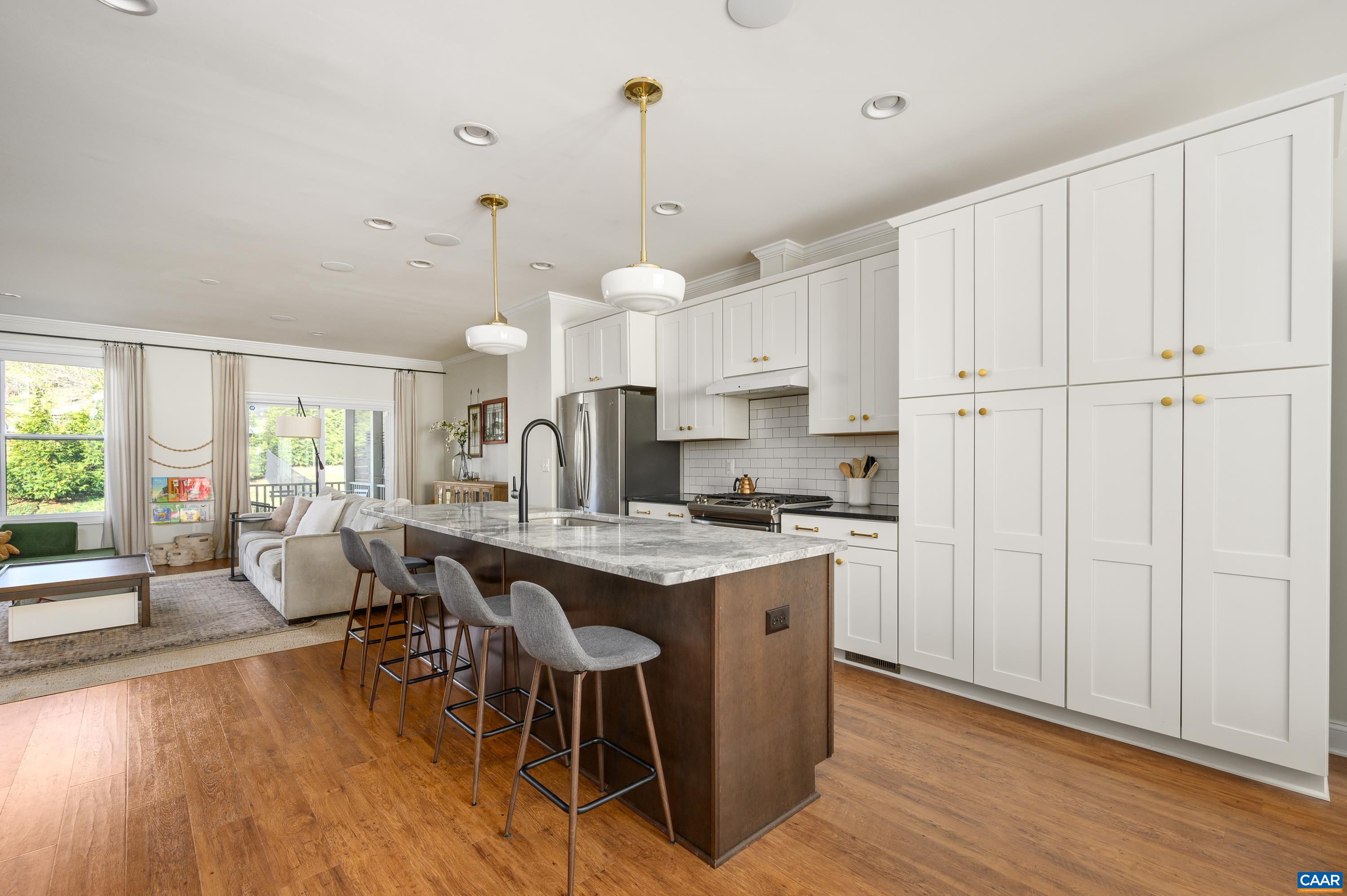 147 Junction Lane Charlottesville, VA 22902 - Photo 8 of 30 a view of a dining room and livingroom with furniture wooden floor a chandelier
