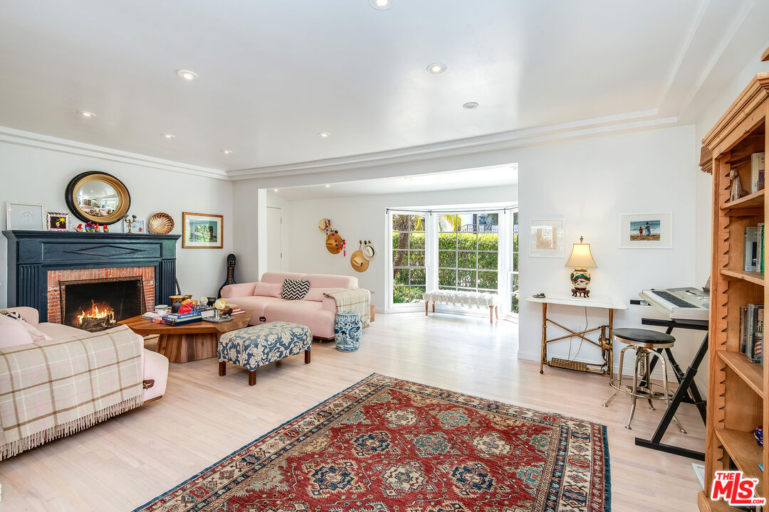 3152 Ellington Drive Los Angeles, CA 90068 - Photo 11 of 21 a living room with furniture a rug and a fireplace